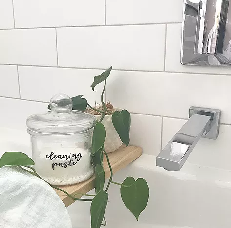 Figgy and Co DIY Cleaning Paste sitting above a bath tub