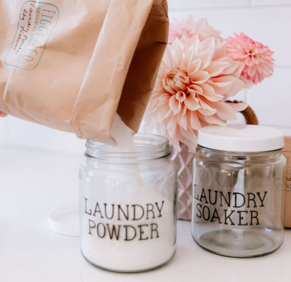 Figgy and Co Laundry Powder jar being refilled