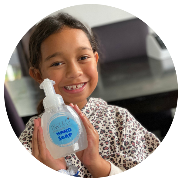 Child Holding Foaming Hand Soap