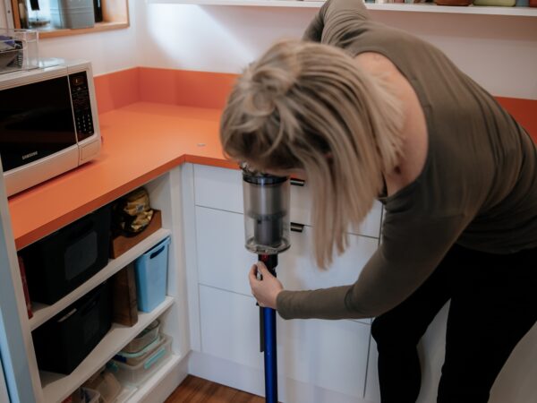 Checking the Dust Cannister of a vacuum cleaner to empty it