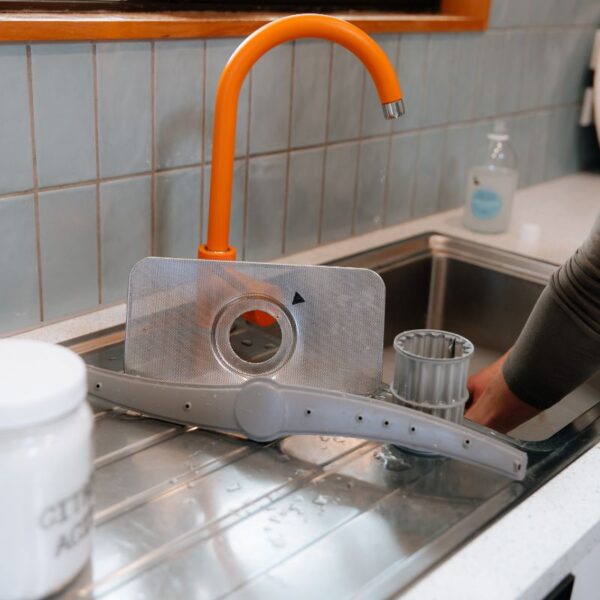 Washing the dishwasher parts with Figgy & Co.'s Home Cleaning Castile Soap