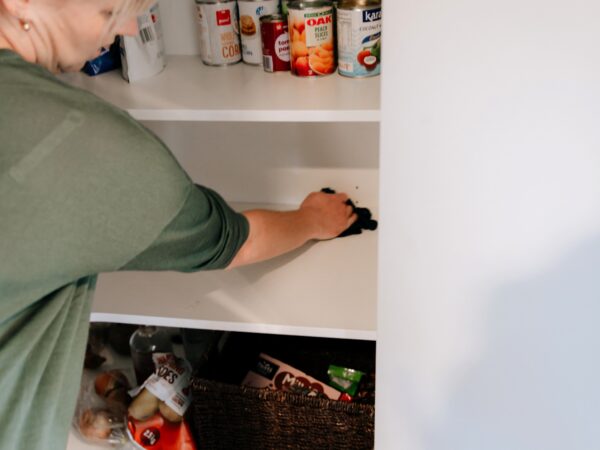 Cleaning the pantry and wiping the shelves