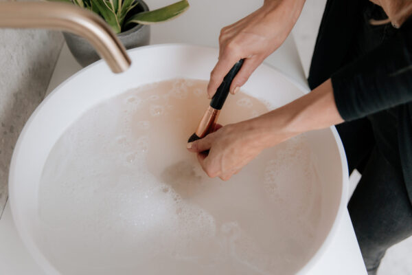 wash your make up brushes with soap and water