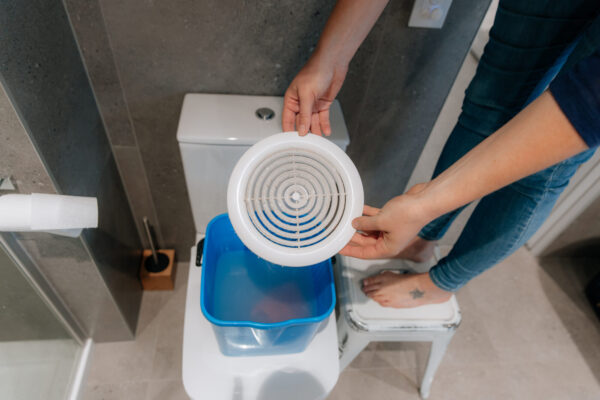 warm soapy water is ideal for washing your bathroom fan cover 