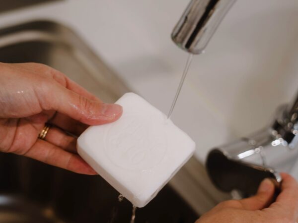 wet the bar of soap up under the tap and use it to remove stains from clothing